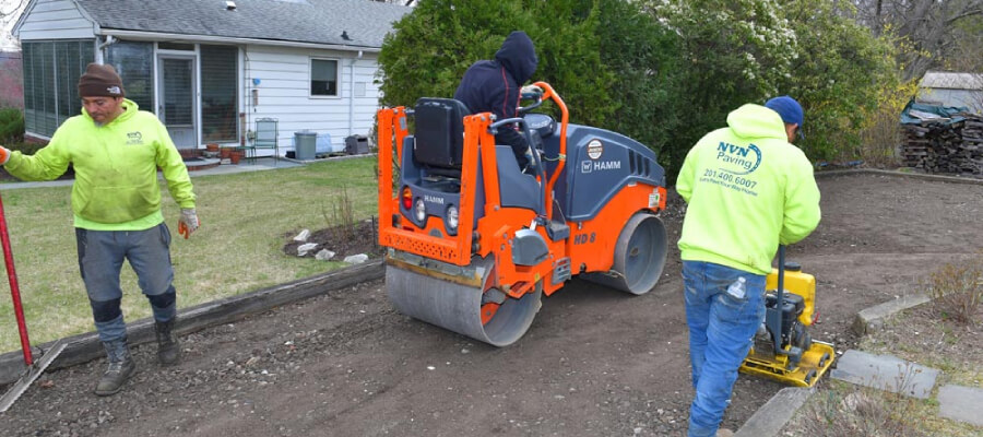 preparing driveway asphalt paving