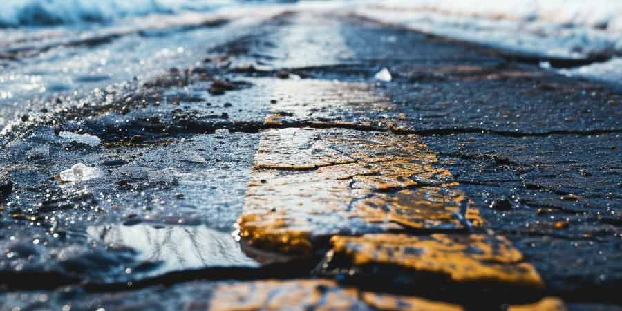 driveway asphalt damaged by snow