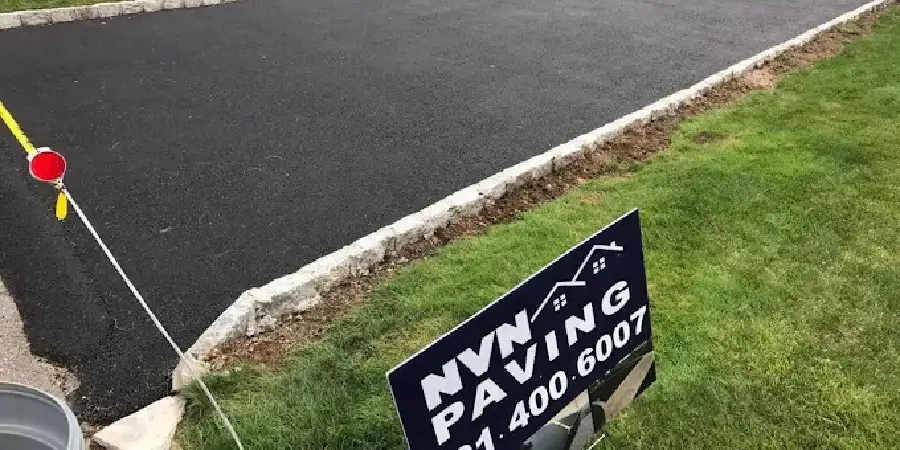 Fresh layer of asphalt sealcoating applied by NVN Paving to a driveway in New Jersey before winter