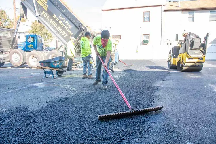 NVN Paving crew installing fresh asphalt driveway in New Jersey, helping homeowners manage permit requirements with ease